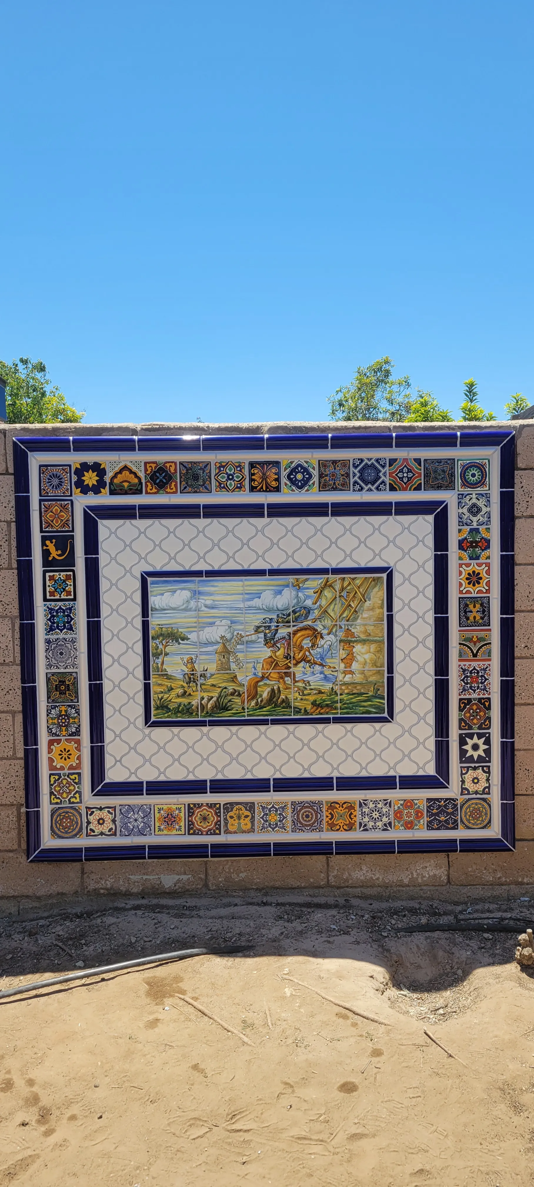 Decorative tile mural installed on an exterior wall